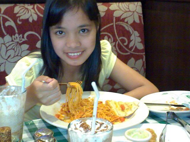 girl eating pasta