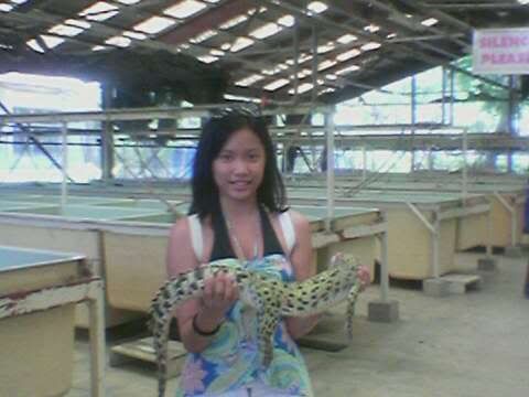 me holding a baby crocodile :)