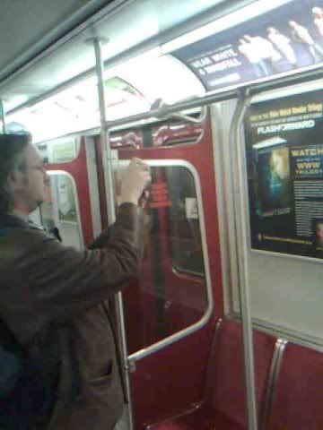 TakingpictureonsubwayforRobSawyer-s.jpg