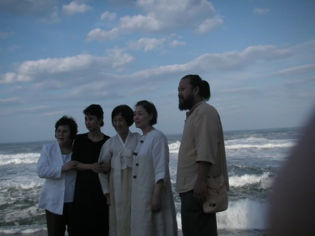 wedding photos in the foreground to a thunderous ocean