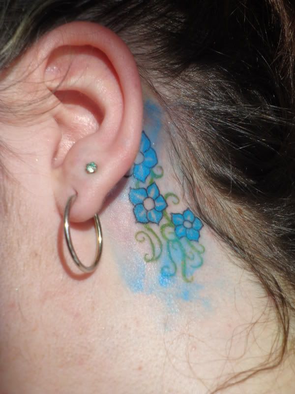 Forget me nots! And the bottom vines are your initials. :D dustins tattoo
