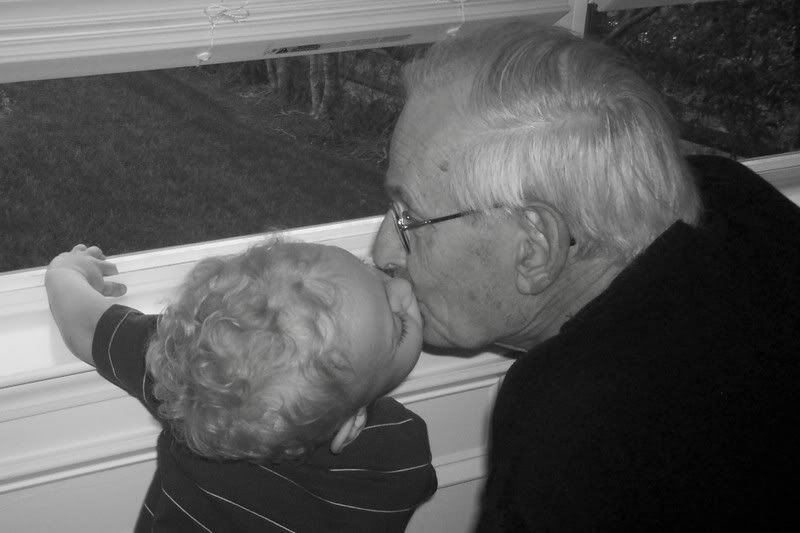 Tre LOVES his papa. He always has a kiss for him:) (I adore this shot!!)