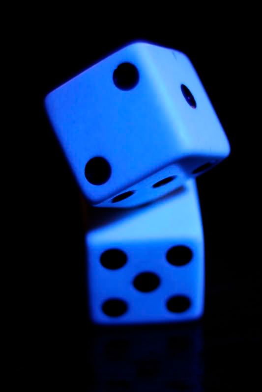 IMAGE: http://i2.photobucket.com/albums/y42/TimothyBath/Diceunderablacklightresizedforweb.jpg