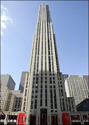 Image borrowed from Yahoo! AFP news. Original alt txt: "New York's renowned Rockefeller Center, which houses the 'Top of the Rock' observation deck, stands tall next to neighboring buildings. The owners of Rockefeller Center plan to re-open the 67th-70th floor observatory to the public, challenging the Empire State Building's lock on the best bird's eye view of the city(AFP/Don Emmert)"