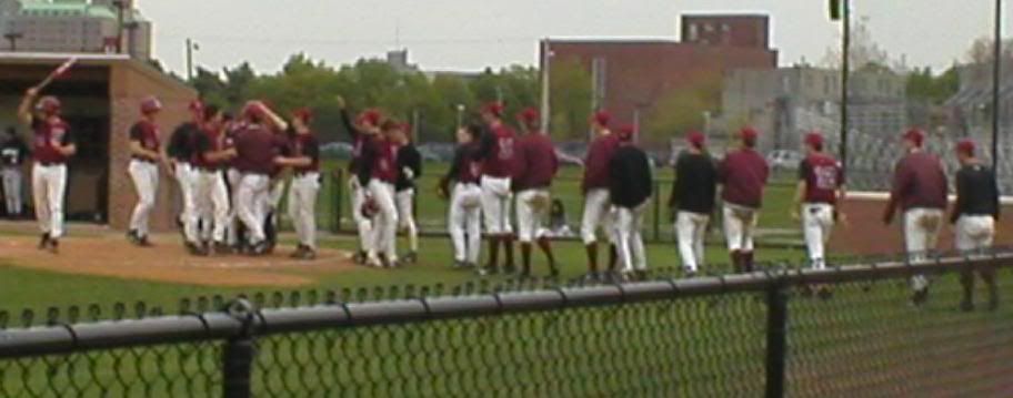 Mann is greeted after his three-run homer in the 8th. Image hosted by Photobucket.com