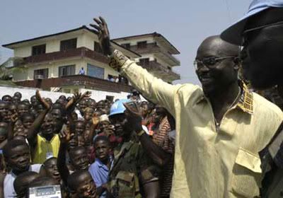 George Weah is welcomed by crowds in Liberia