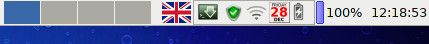 Keyboard layout icon on Xfce Panel POWERED BY LINUX badge on Mesh Edge DX laptop